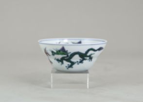 A Small Doucai Dragon Bowl, six character underglaze blue mark of Yongzheng, the ogival rounded