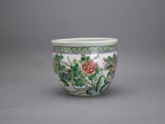 A Miniature 'famille verte' Jardiniere, Guangxu, with a phoenix perched on rocks among peonies, star