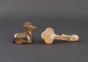 An Agate Belthook; and an Agate Deer, Han dynasty, the belthook elegantly formed as a duck, and