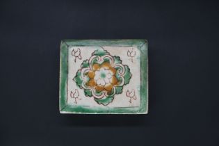 A rare small Sancai 'floral' pillow, Tang dynasty, of rectangular shape, the flat top and base