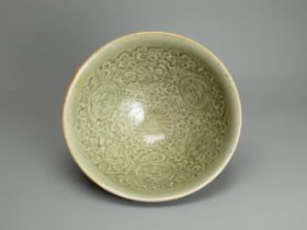 A Moulded Yaozhou Chrysanthemum Bowl, Northern Song dynasty, the almost conical interior with a