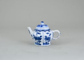 A Miniature Blue and White Teapot and a Cover, Kangxi, , the sides moulded with panels painted