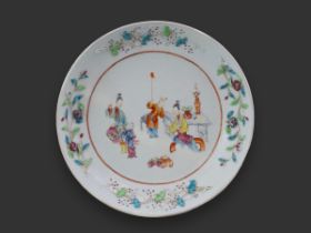 A 'famille rose' Dish with Applique decoration, Qianlong, with a central medallion of two ladies and