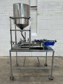 Universal Posifill Semi-Automatic Volumetric 2-Head Liquid Filler fitted into S/S trolley