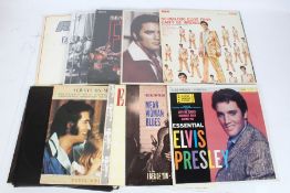 A collection of approx. 15 Elvis Presley LPs and 12" singles to include King In The Ring (