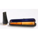 Cigar holder with amber effect mouth piece, housed in a blue suede lined leather case, 11.5cm