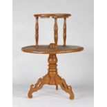 A 19th century pine and beech scumbled dumb-waiter With two tiers, the smaller circular top tier