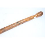 Japanese bamboo walking stick, carved with a figure fighting a serpent, signed to lower section,