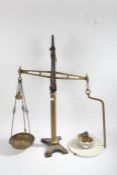 A set of balance scales, with a porcelain platform and brass dish 86cm high