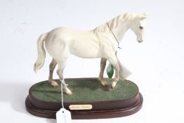 Royal Doulton horse 'Desert Orchid' raised on wooden plinth, with original box, 23cm wide