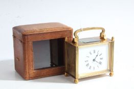 French brass carridge clock, with a white face and Roman numerals, movement stamped SFRA, with key