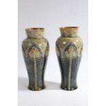 Ethel Beard - Pair of Royal Doulton stoneware vases, the vases decorated with Art Nouveau style
