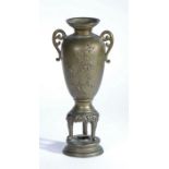 Chinese Bronze Vase, the flared stepped rim flanked by two pierced scroll handles, the baluster body