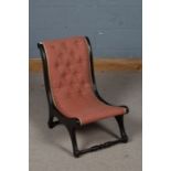 Unusual Victorian mahogany X frame chair, with a upholstered button back raised on turned stretchers