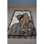 Wall hanging depicting a lion standing on a rock, the wall hanging formed from rabbit skins, 188cm