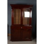 Victorian mahogany bookcase, with an arched glazed top section decorated with acanthus leaf moulding
