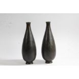 Pair of Japanese bronze vases, Meiji period, the bulbous bodies with stylised leaf decoration,