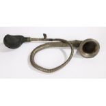Boa-Constrictor car horn, the flared trumped end with oval brass name plate above a tapering