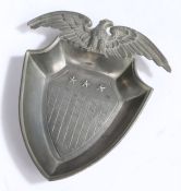 Pewter ash tray in the form of the shield of the United States surmounted by an eagle with wings