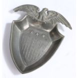 Pewter ash tray in the form of the shield of the United States surmounted by an eagle with wings