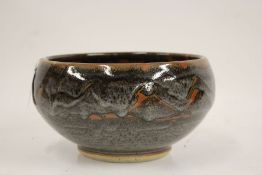 John Leach for Muchelney Pottery, a bowl, the bulbous body with wax resist decoration, stamped "
