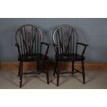 Pair of 20th century oak wheel and stick back Windsor arm chairs, 96cm high