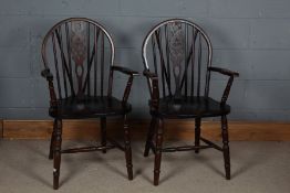 Pair of 20th century oak wheel and stick back Windsor arm chairs, 96cm high