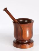Turned wooden pestle and mortar, the pestle 24cm long, the mortar 16.5cm high