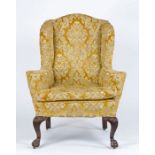 Victorian wingback chair, the yellow foliate and scroll upholstered chair with loose seat cushion,