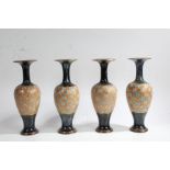 Set of four Royal Doulton Slater's Patent vases, the baluster shaped vases with slender necks with a