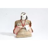 Japanese straw filled doll, 20th century, with carved wooden hands, 23cm tall