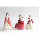 Two Royal Doulton figurines 'Paisley Shawl' and 'Autumn Breezes' and a Royal Worcester figurine '
