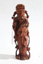 Chinese carved boxwood figure, depicting a figure holding a ruyi sceptre with left hand raised, 21cm