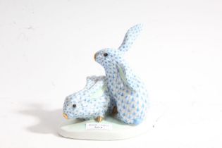 Herend model of two rabbits, by Eva Vastagh, with a shaped base with marks "Vastag Eva 1928", with a