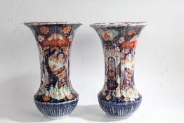 Pair of 19th/20th century Japanese Imari vases of unusual form, with a ribbed body and a flared rim,