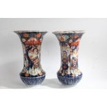 Pair of 19th/20th century Japanese Imari vases of unusual form, with a ribbed body and a flared rim,