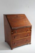 A 19th Century mahogany miniature bureau, the fall above three long drawers, on ogee bracket feet,