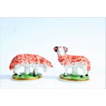 Pair of Samson porcelain sheep, a ram and ewe, psuedo Chelsea gold anchor mark to each, 8cm and