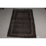Early 20th century Afghanistan style wool rug, with original retailers webbing for Chamberlain