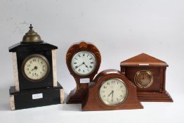 Four various mantle clocks, top include and Edwardian balloon shaped example, a late Victorian black