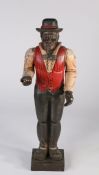 Standing carved figure modelled as a gentleman with black bowler hat, red waistcoat with black