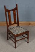 Arts and Crafts mahogany and boxwood inlaid nursing chair, early 20th century, having curved rail
