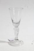 An 18th century drinking glass, circa 1730, with drawn trumpet bowl, six-sided Silesian stem, on a