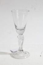 An 18th century drinking glass, circa 1730, with drawn trumpet bowl, six-sided Silesian stem, on a