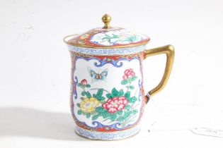 Cantonese enamel chocolate cup and cover, the red ground with foliate decoration and cartouches