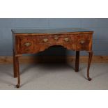 George III style walnut lowboy/dressing table, the rectangular top above three drawers above