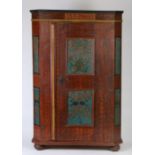 A 19th Century Swedish painted cabinet, in iron red swirls and blue scroll panels, the frieze with