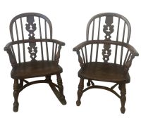 A pair of late 19th century yew & elm child's Windsor chairs, one with rockers, spindle-backs with