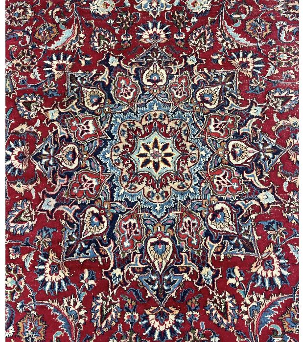 A Tabriz carpet, central light blue floral medallion on red field, light blue spandrels, with all- - Image 2 of 2