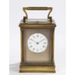 A good late 19th Century French brass carriage clock, of large proportions, with a five bevelled